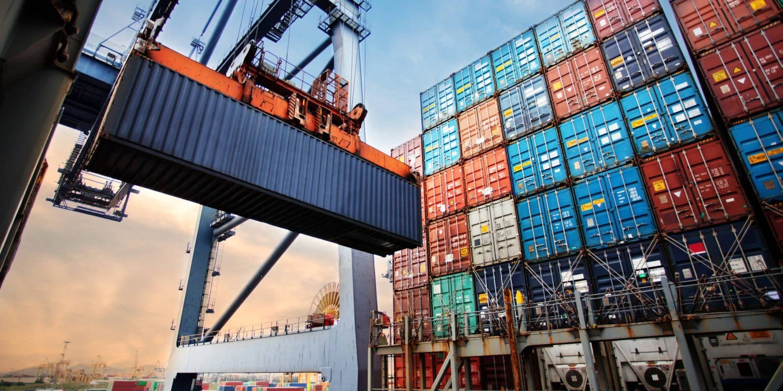 Shipping containers being loaded at port